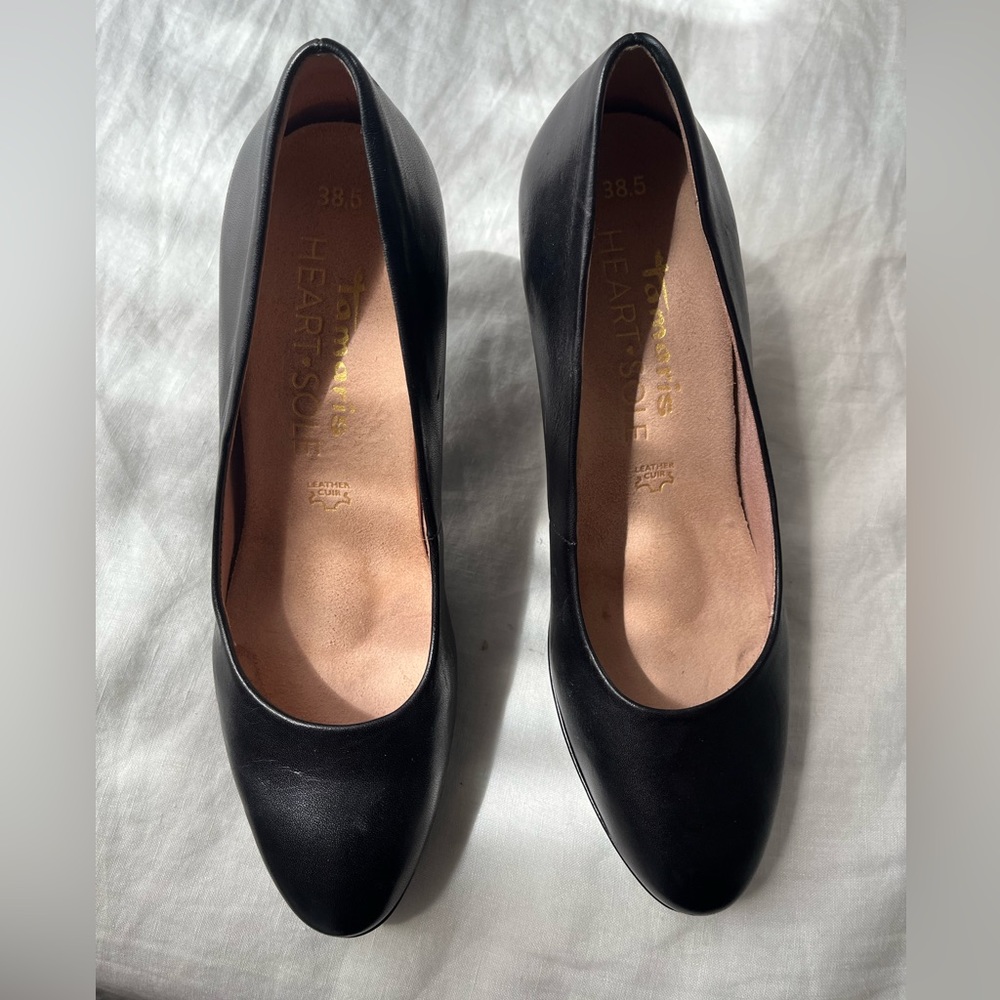 Black leather pumps